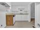 Functional kitchen features white cabinets, a sink, and essential appliances at 605 Dunbar St, Durham, NC 27701