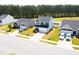 An aerial view of a well-maintained home on a sunny day, showcasing a vibrant and active community at 608 Crackling Ct, Zebulon, NC 27597