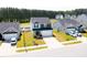 Aerial view of a well-planned neighborhood showcasing modern homes and manicured lawns at 608 Crackling Ct, Zebulon, NC 27597