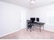 Bedroom with neutral carpet, white walls, a computer desk and chair with two monitors on the desk at 608 Crackling Ct, Zebulon, NC 27597