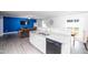 Open kitchen with granite counters, stainless appliances, and a view to the living room at 608 Crackling Ct, Zebulon, NC 27597