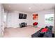 This is a finished space with a large tv mounted on the wall, and carpeted floors at 608 Crackling Ct, Zebulon, NC 27597