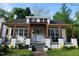 Charming renovated bungalow features a pergola-covered front porch and inviting curb appeal at 614 Henry St, Rocky Mount, NC 27803