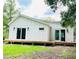 Modern home with plank siding and large sliding glass doors leading to a wooden deck at 614 Henry St, Rocky Mount, NC 27803