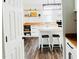 Modern kitchen with island seating, open shelving, butcher block countertops, and stainless appliances at 614 Henry St, Rocky Mount, NC 27803