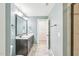Bathroom featuring double sinks with marble countertops and modern fixtures at 6323 Pesta Ct, Raleigh, NC 27612