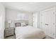 Bedroom featuring a bed, nightstand, and double-door closet at 6323 Pesta Ct, Raleigh, NC 27612