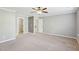 Spacious empty bedroom with carpeted floors, and a ceiling fan at 6323 Pesta Ct, Raleigh, NC 27612