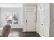 Inviting foyer with hardwood floors, white trim, and natural light streaming through a window at 6323 Pesta Ct, Raleigh, NC 27612