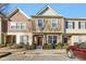 Charming townhouse featuring a well-maintained lawn and a classic exterior design in a suburban setting at 6323 Pesta Ct, Raleigh, NC 27612