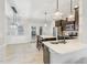 Modern kitchen with stainless steel appliances, dark cabinets, and pendant lighting over the island at 6323 Pesta Ct, Raleigh, NC 27612