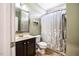 Standard bathroom with shower/tub combo, toilet and vanity at 6901 Rex Rd, Holly Springs, NC 27540