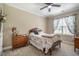 Cozy bedroom with plush carpet, window and ample natural light at 6901 Rex Rd, Holly Springs, NC 27540