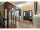 Inviting foyer with high ceilings, dark front door, and wood-look flooring at 6901 Rex Rd, Holly Springs, NC 27540