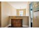 This hallway boasts a vintage wooden cabinet with drawers and a decorative light fixture at 6901 Rex Rd, Holly Springs, NC 27540