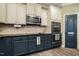 Modern kitchen with sleek stainless steel appliances and ample counter space at 6901 Rex Rd, Holly Springs, NC 27540