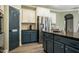 Well-appointed kitchen with stainless steel refrigerator and granite countertops at 6901 Rex Rd, Holly Springs, NC 27540