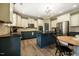 Charming kitchen with granite countertops, stainless steel appliances, and a central island at 6901 Rex Rd, Holly Springs, NC 27540