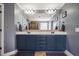 A well-lit main bathroom featuring double sinks and a large mirror at 6901 Rex Rd, Holly Springs, NC 27540