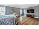 Comfortable main bedroom with wood-look flooring and modern decor at 6901 Rex Rd, Holly Springs, NC 27540