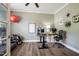 Home office with hardwood floors, a ceiling fan, and ample room for exercise equipment at 6901 Rex Rd, Holly Springs, NC 27540