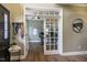 View of the home office which features wood flooring, a ceiling fan, and a computer desk at 6901 Rex Rd, Holly Springs, NC 27540
