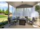 This screened patio offers comfortable seating and views of the yard at 6901 Rex Rd, Holly Springs, NC 27540