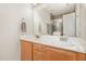 Bright bathroom featuring double sinks, a large mirror and vanity, and a glass-enclosed shower at 722 E Pine Ave, Wake Forest, NC 27587
