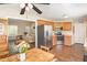 Bright kitchen flowing into the dining area, featuring stainless steel appliances and ample cabinet space at 722 E Pine Ave, Wake Forest, NC 27587