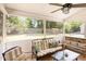 Inviting screened porch with comfortable seating and views of the backyard, great for relaxation at 722 E Pine Ave, Wake Forest, NC 27587
