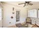 Cozy screened porch with overhead fan, and comfortable seating for relaxing outdoors at 722 E Pine Ave, Wake Forest, NC 27587