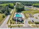 Aerial view highlights a neighborhood pool, playground, and recreational area for community enjoyment at 743 Hadstock Path Path, Zebulon, NC 27597