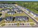 Extensive aerial view displays a neighborhood surrounded by lush trees at 743 Hadstock Path Path, Zebulon, NC 27597