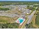 This aerial view displays the neighborhood amenities including the pool, playground and generous green spaces at 743 Hadstock Path Path, Zebulon, NC 27597