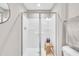 Bright bathroom features a glass-enclosed shower with a convenient bench at 743 Hadstock Path Path, Zebulon, NC 27597