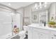 Bright bathroom with a glass-enclosed shower, vanity, and elegant fixtures at 743 Hadstock Path Path, Zebulon, NC 27597