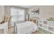 Cozy bedroom with natural light, white furniture, and decorative artwork at 743 Hadstock Path Path, Zebulon, NC 27597