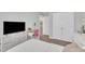 Bedroom area includes a desk, closet, and television over a dresser at 743 Hadstock Path Path, Zebulon, NC 27597
