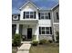 Charming two-story home features stone accents, black shutters, and a welcoming front porch at 743 Hadstock Path Path, Zebulon, NC 27597