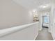 Upstairs hallway featuring neutral walls, lighting, and carpet flooring at 743 Hadstock Path Path, Zebulon, NC 27597