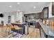 Well-equipped kitchen featuring stainless steel appliances, dark cabinets, and granite countertops at 743 Hadstock Path Path, Zebulon, NC 27597