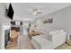 Spacious living area with a cozy fireplace, plush sectional sofa, and open layout leading to the kitchen at 743 Hadstock Path Path, Zebulon, NC 27597