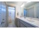 Bathroom featuring a double sink vanity, modern fixtures, and a bright shower area at 777 Fireball Ct, Knightdale, NC 27545