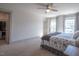 Bedroom with neutral walls, and doorways to the hallway and walk-in closet, featuring a Queen bed at 777 Fireball Ct, Knightdale, NC 27545