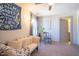 Relaxing bedroom space featuring a comfortable futon and natural light from the window at 777 Fireball Ct, Knightdale, NC 27545