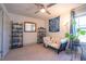Cozy bedroom with a modern futon, stylish decor, and ample natural light at 777 Fireball Ct, Knightdale, NC 27545