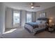 Inviting bedroom with ceiling fan, natural light, and stylish decor for relaxation at 777 Fireball Ct, Knightdale, NC 27545