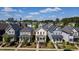 Charming yellow two-story home featuring a cozy front porch and beautifully landscaped front yard at 777 Fireball Ct, Knightdale, NC 27545