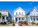 A charming two-story home showcases a welcoming front porch and vibrant landscaping in a neighborhood setting at 777 Fireball Ct, Knightdale, NC 27545