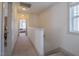 Bright hallway features neutral carpet, paint, and natural light from an end window at 777 Fireball Ct, Knightdale, NC 27545
